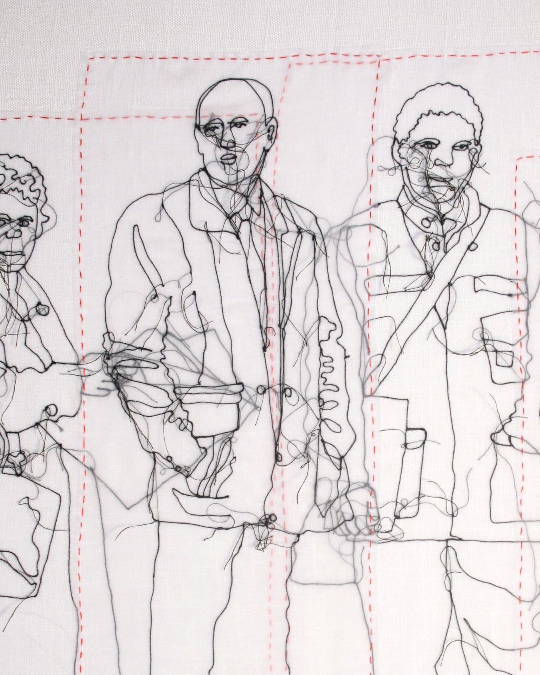 A stitched line illustration in black thread on a white cotton background of a group of commuters waiting for the train