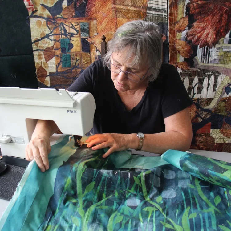 Bobbi Baugh, sewing in her studio.