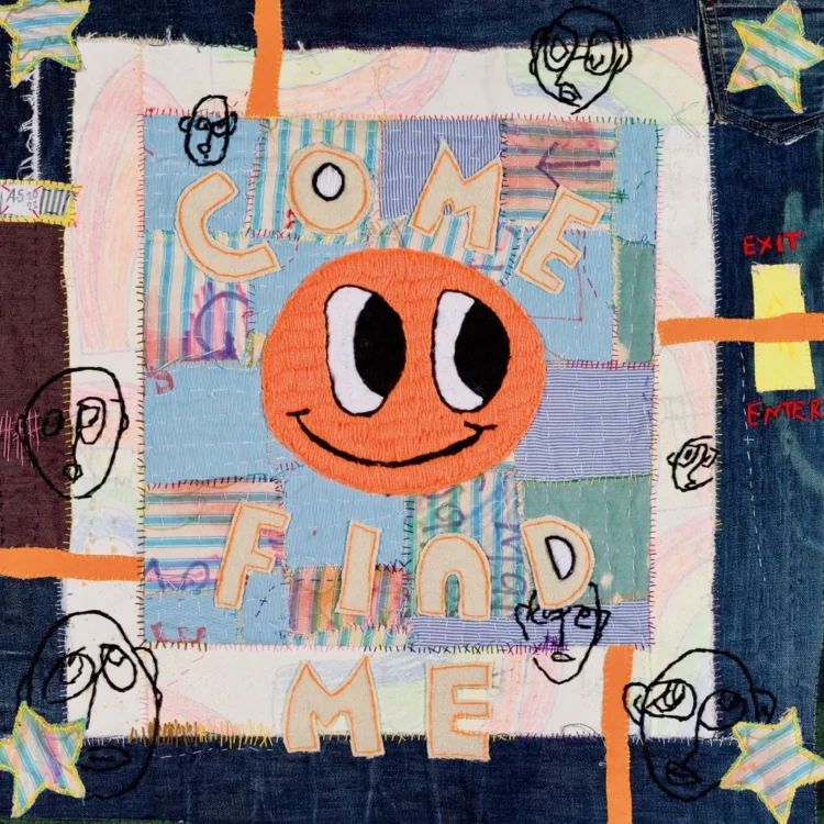 Anthony Stevens, Searching for the Orange One, 2022. 21cm x 61cm (8" x 24"). Hand embroidery, appliqué, hand stitch. Mixed textiles, mixed threads, marker pen, card, felt.