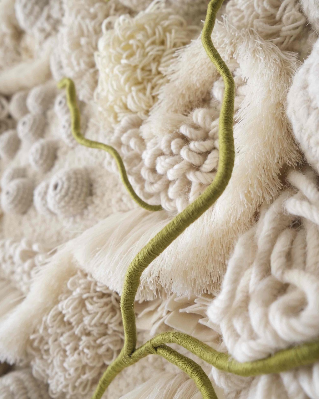 Vanessa Barragao, Afterlife I (detail), 2023. 140cm x 30cm x 230 cm (55" x 12" x 91"). Latch hook, crochet, fibre manipulation. Wool, tencel, jute backing, brass signature badge, repurposed fibres from textile factories.