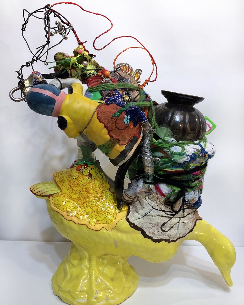 Julie Peppito, Survivor, 2019. 38cm x 51cm x 20cm (15” x 20” x 8”). Ceramic, found objects, thread, beads, paper mâché, fabric, yarn, wire.