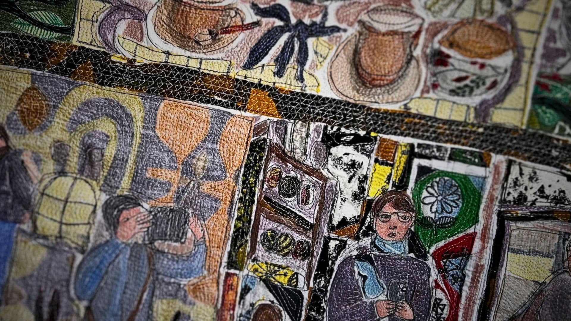 A close up of a stitched abstract artwork featuring tea cups and a man standing.