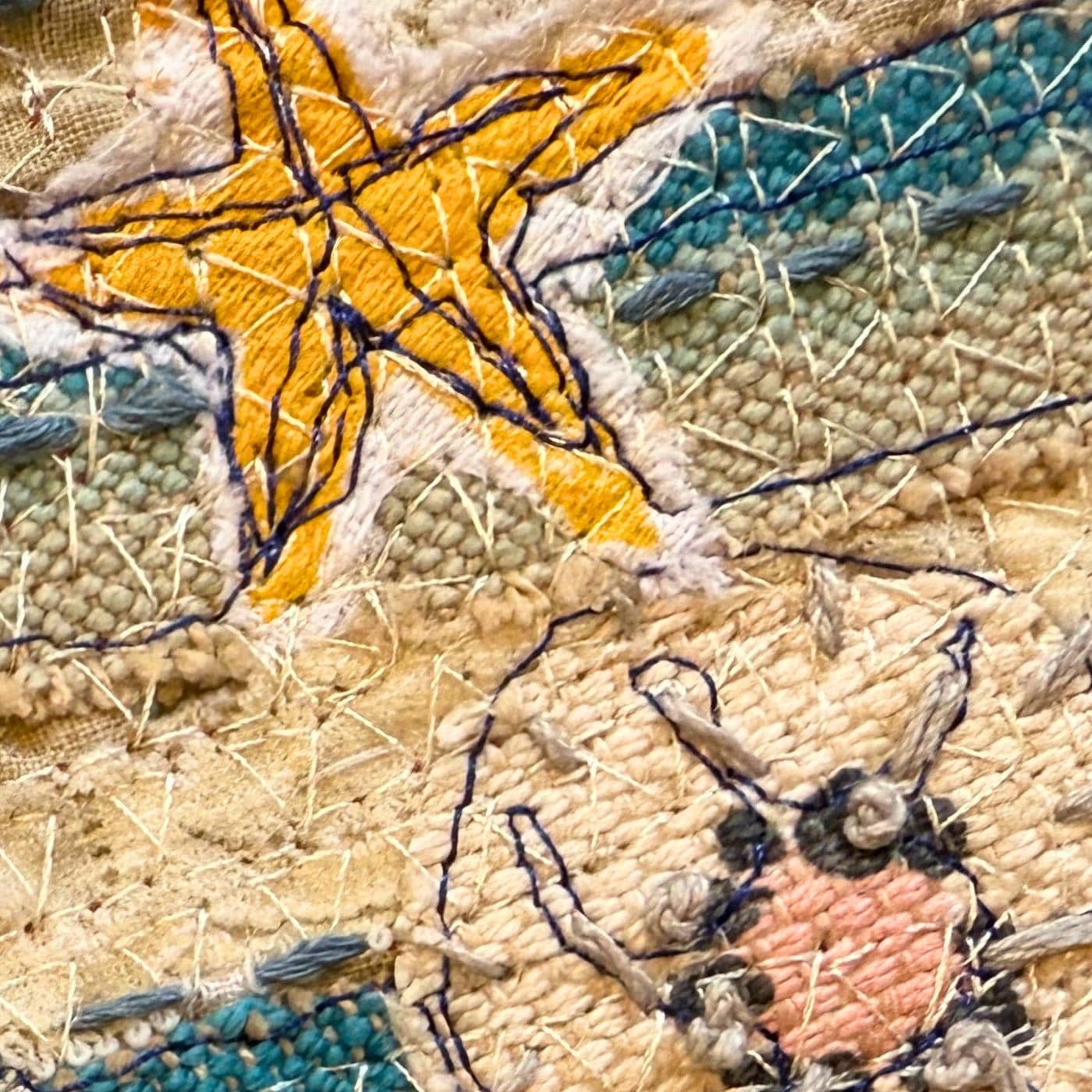 A close up of a layered stitched portrait of a starfish and a seascape.