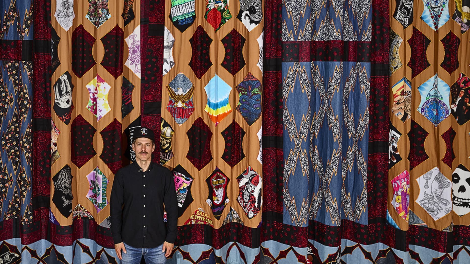 Ben Venom, Little Saint Curtain, 2022. 9m x 5m (30' x 15'). Appliqué. Custom fabricated curtain, recycled T-shirts, denim and fabric. Commissioned by Ken Fulk.