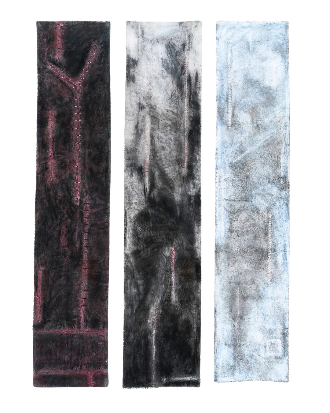 Three long rectangular fabric artworks