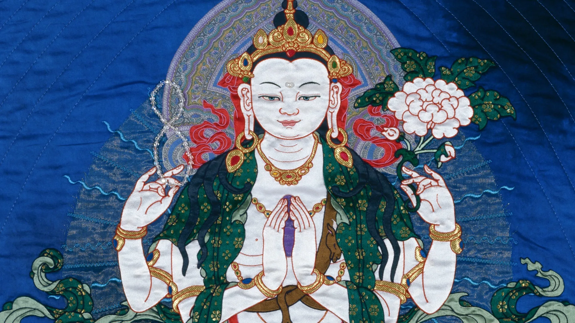 Leslie Rinchen-Wongmo, Chenrezig, For The Benefit of All Beings (detail), 2008. 109cm x 79cm (43" x 31"). Hand stitch, Tibetan appliqué, machine quilting. Silk, gold, cotton, horsehair, crystal beads.