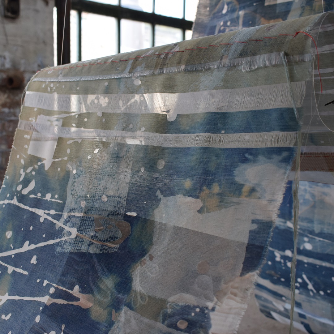 Hannah Lamb, [De]Constructed Cloth (detail), 2019. 300cm x 160cm x 50cm (10ft x 5¼ft x 20"). Cyanotype, devoré, digital print, stitch and appliqué. Mixed fibre fabric, threads, mirror, vintage bobbin.