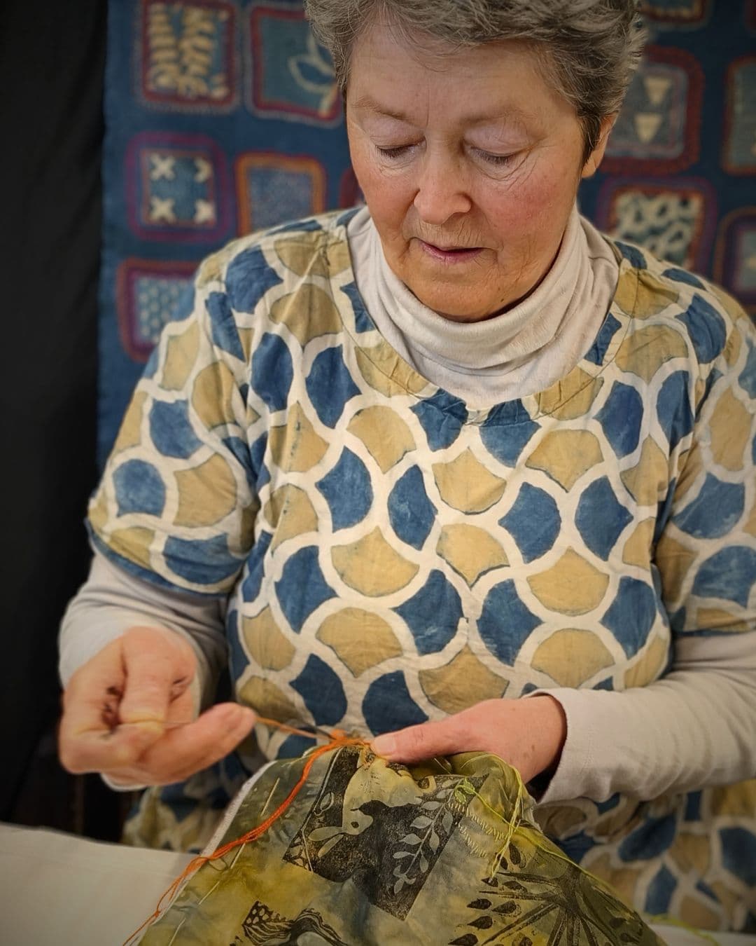 Dijanne Cevaal, stitching in her work room at home.