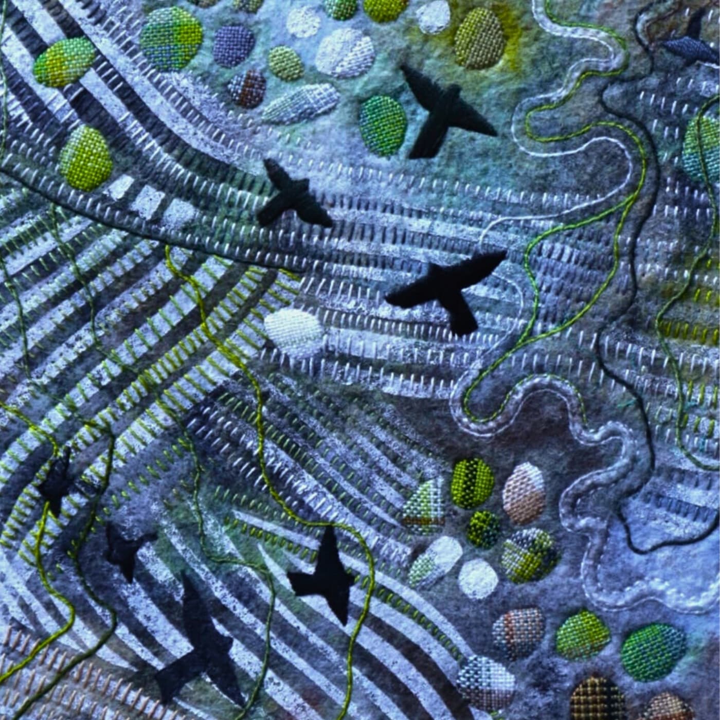 A close up of a textile artwork