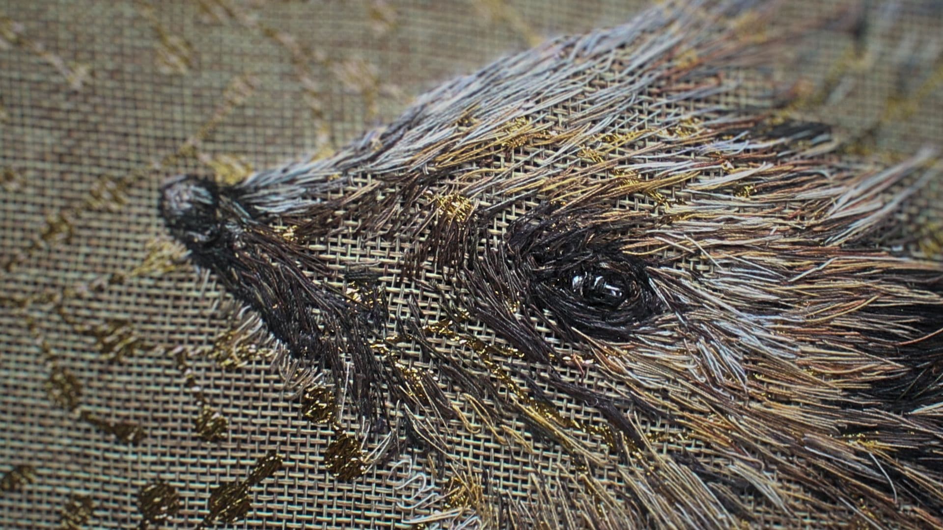 A close up of an embroidery of a Hedgehog