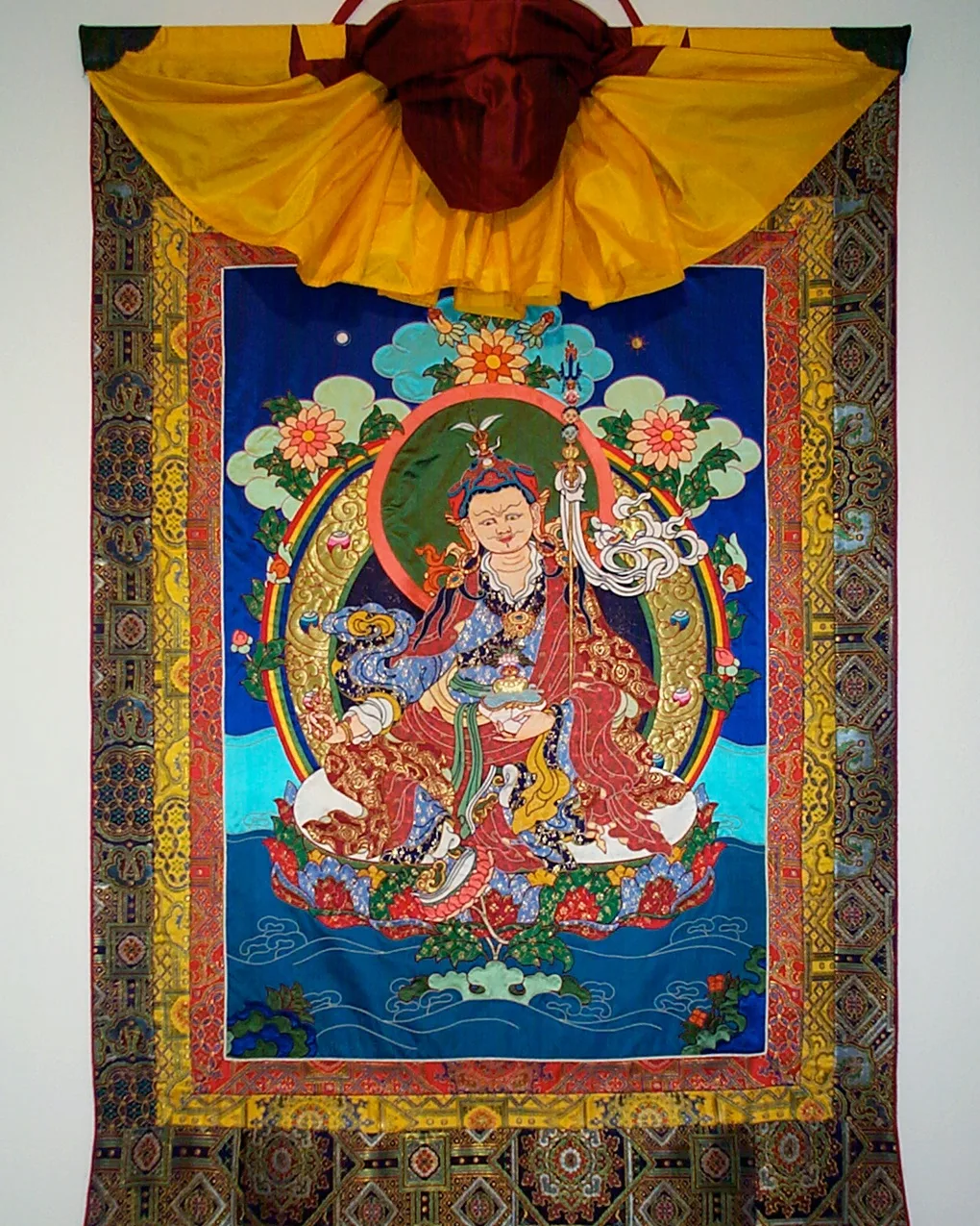 Leslie Rinchen-Wongmo, Guru Rinpoche, 1999, 79cm x 54cm (31” x 21”) plus brocade frame. Hand stitch, Tibetan appliqué. Silk satin, brocade, horsehair.