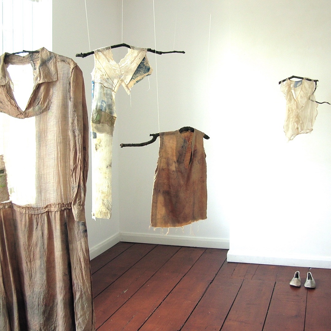 Hannah Lamb, In Search of Green, 2013. Installation, dimensions vary. Cyanotype, hand embroidery, appliqué, natural dyeing. Vintage garment, cotton and silk fabrics.