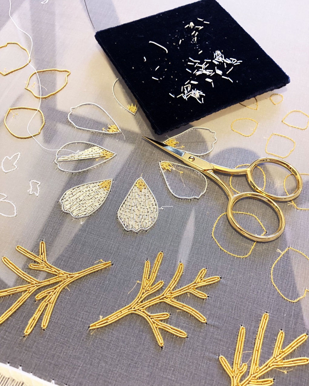 Hannah Mansfield, Summer Flowers sculpture (work-in-progress), 2019. Goldwork embroidery. Gold and silver goldwork wires, silk organza, metallic thread, metal beads, metallic leaf, silk ribbon, wire, tissue paper, clay. Goldwork scissors from Golden Hinde.