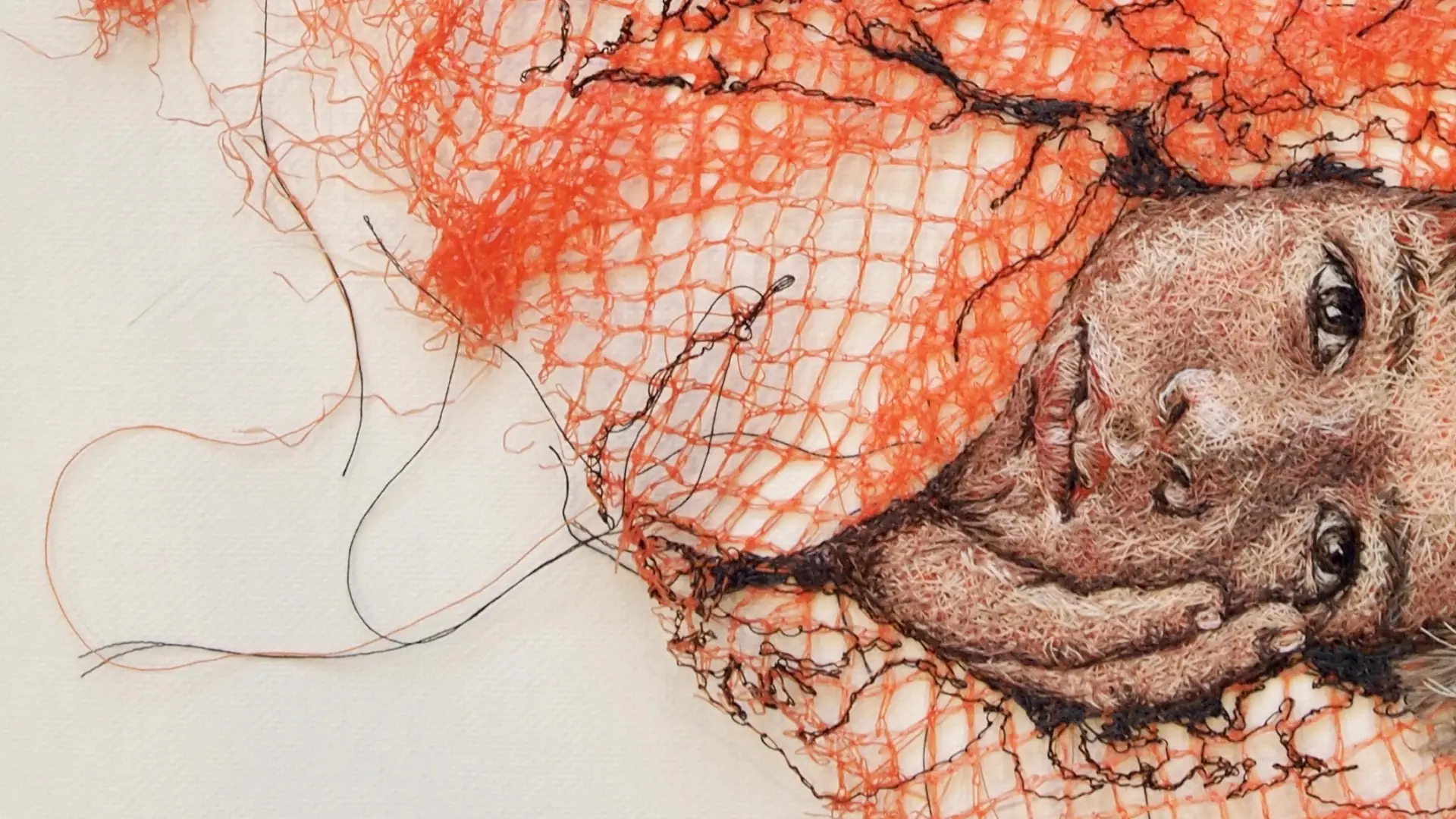 Melissa Emerson, I Know Your Face (detail), 2022. 23cm x 25cm (9" x 10"). Hand embroidery. Fruit netting, sewing machine threads.