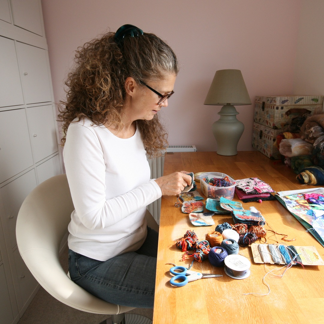 Jane hand stitching in her studio.