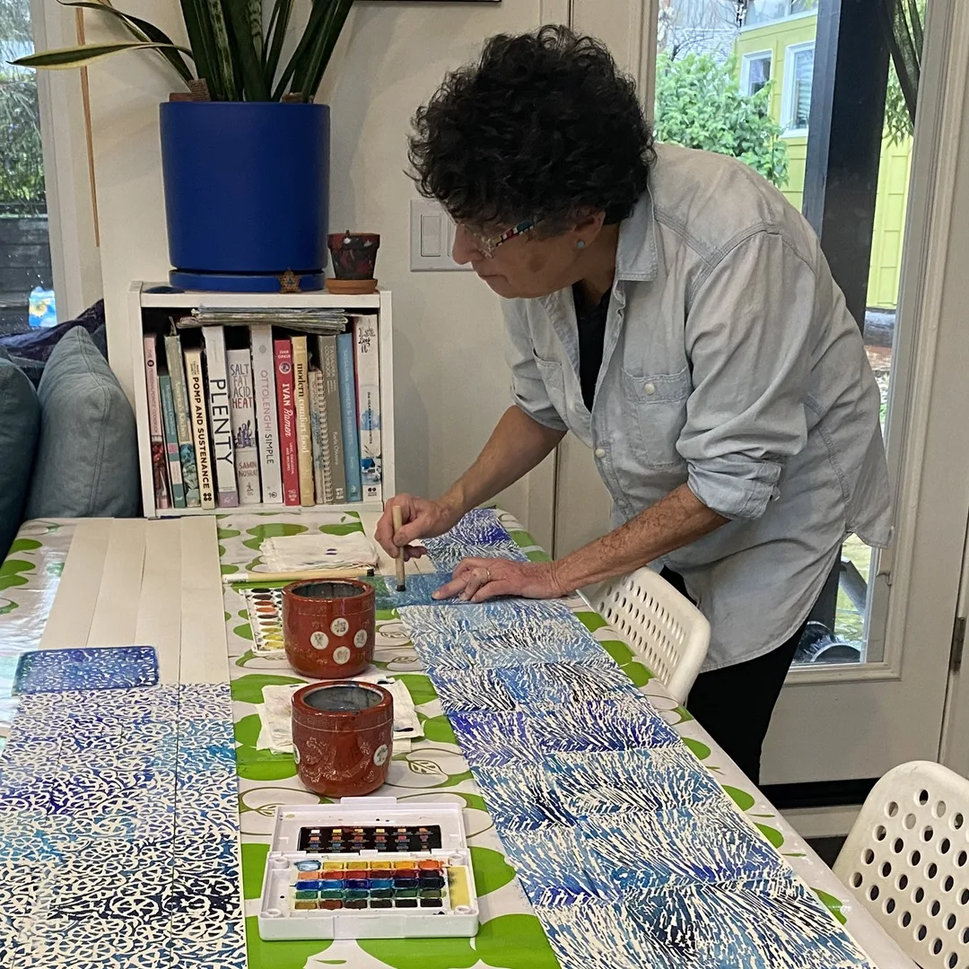 Daniella Woolf stencilling in the living room. Photo: Kim Tyler.