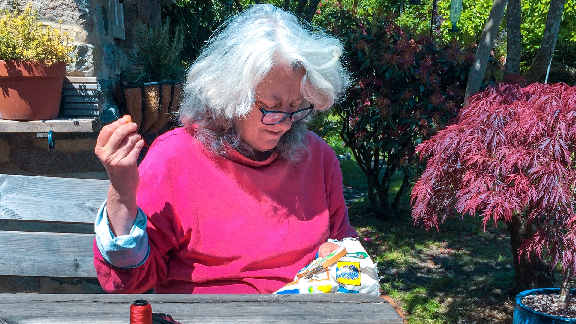 Ali stitching to the sound of swifts overhead in her garden