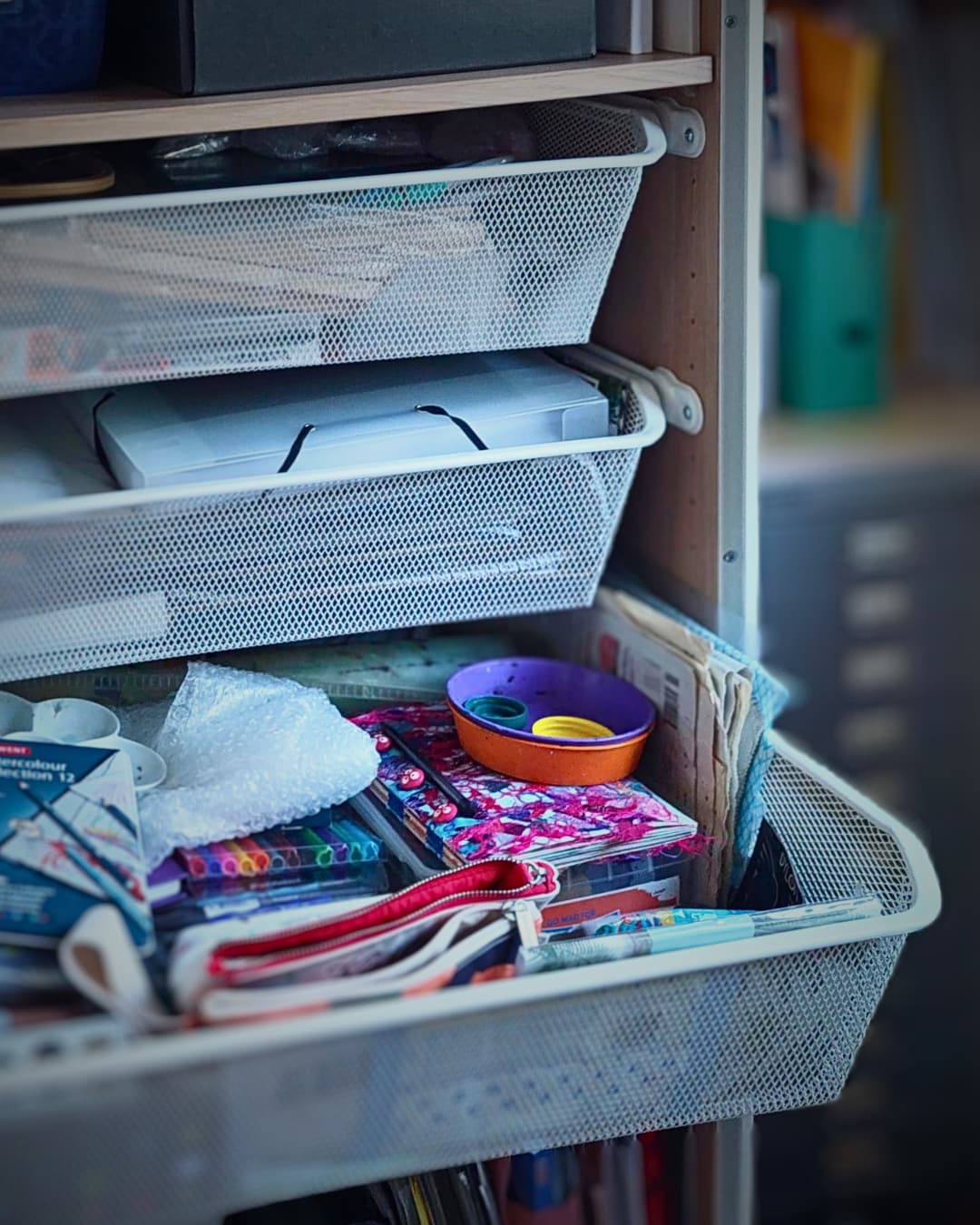 A drawer full of art supplies