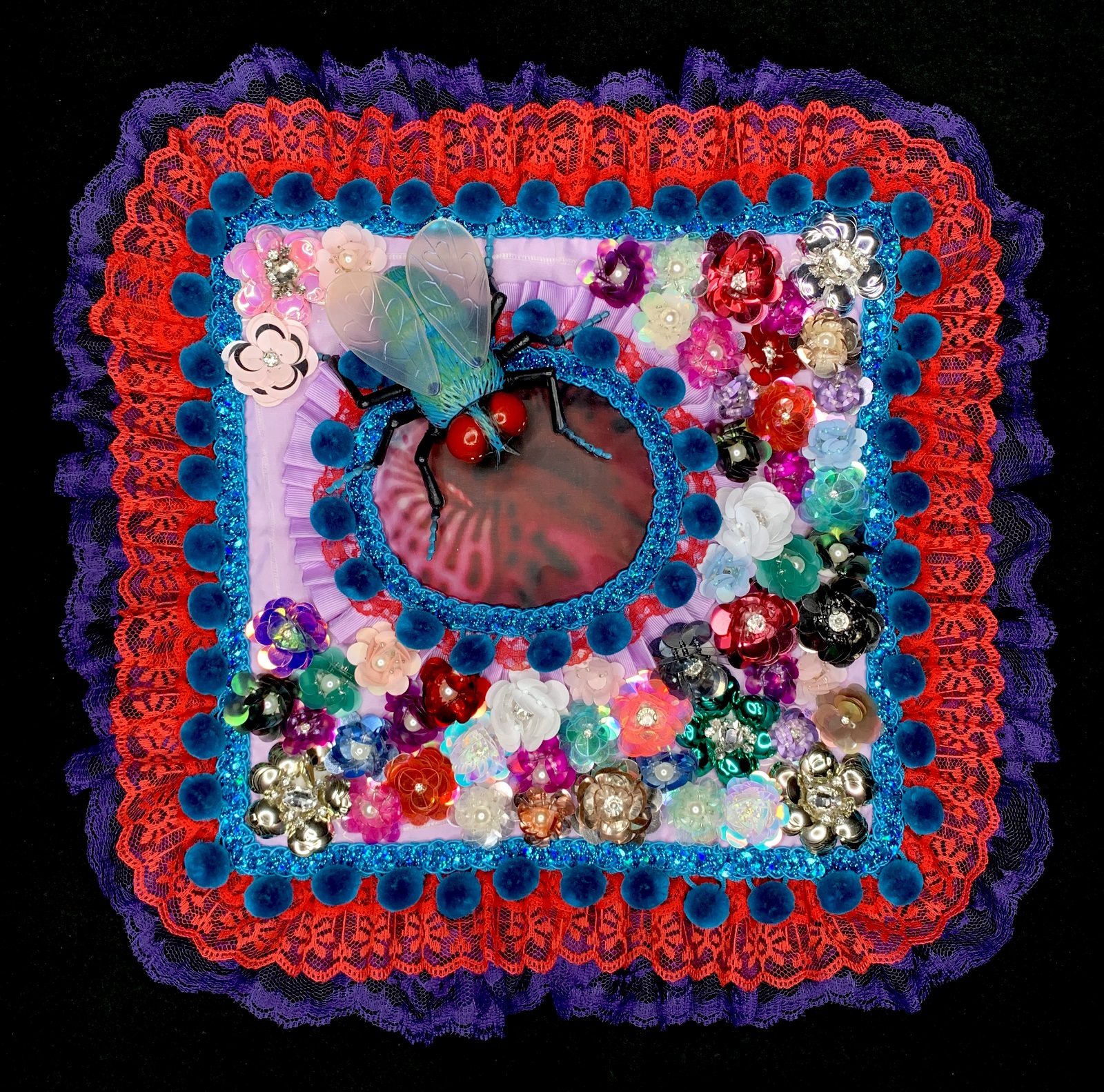 K Johnson Bowles: Unfinished Battles, 2020, 16 x 16 x 3 inches, various fabrics, plastic, rhinestones, sequins, plastic fly, heat transferred photo, hand-sewn on vintage handkerchief