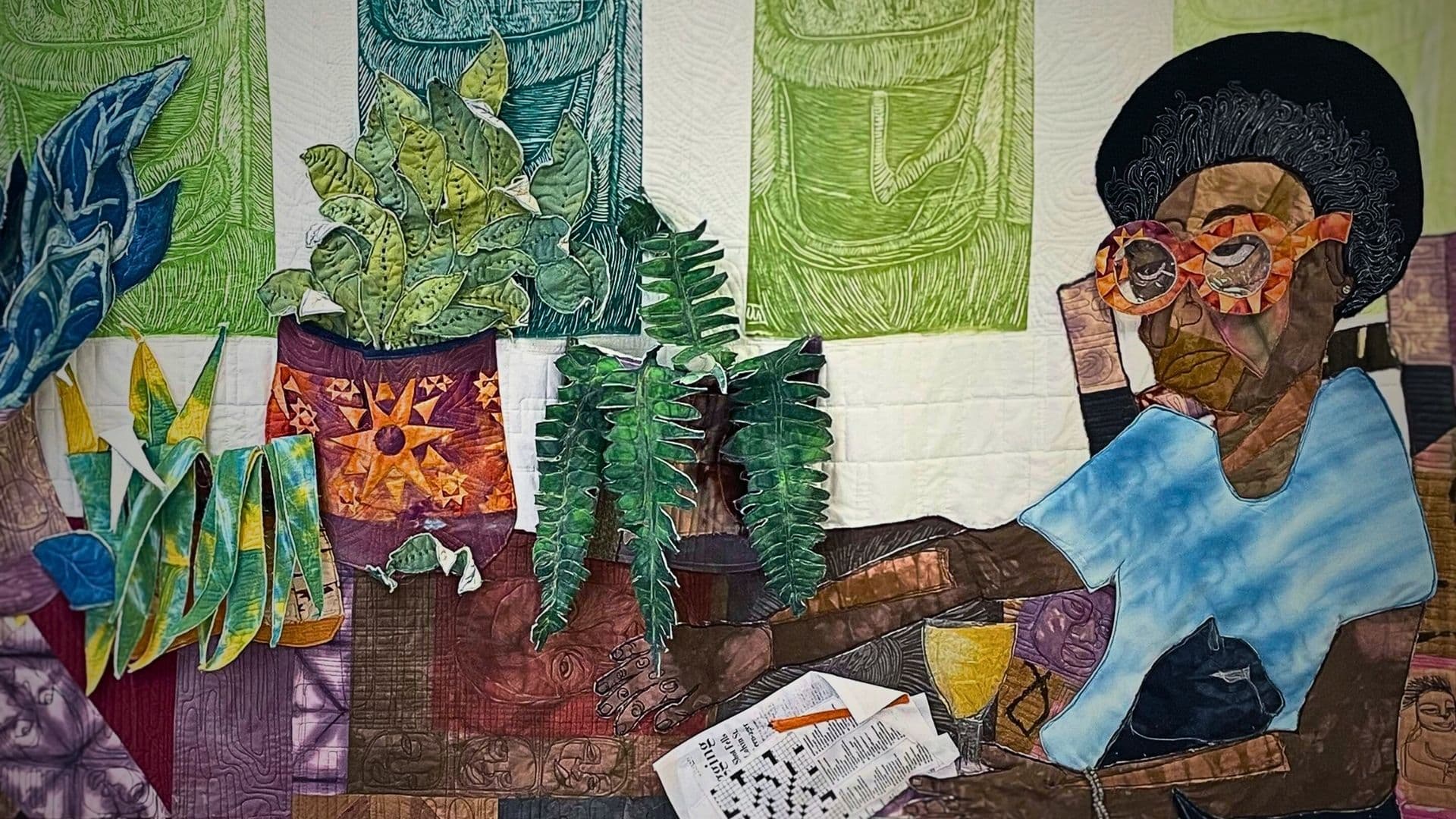 An art quilt of a woman sitting on in an armchair surrounded by plants.