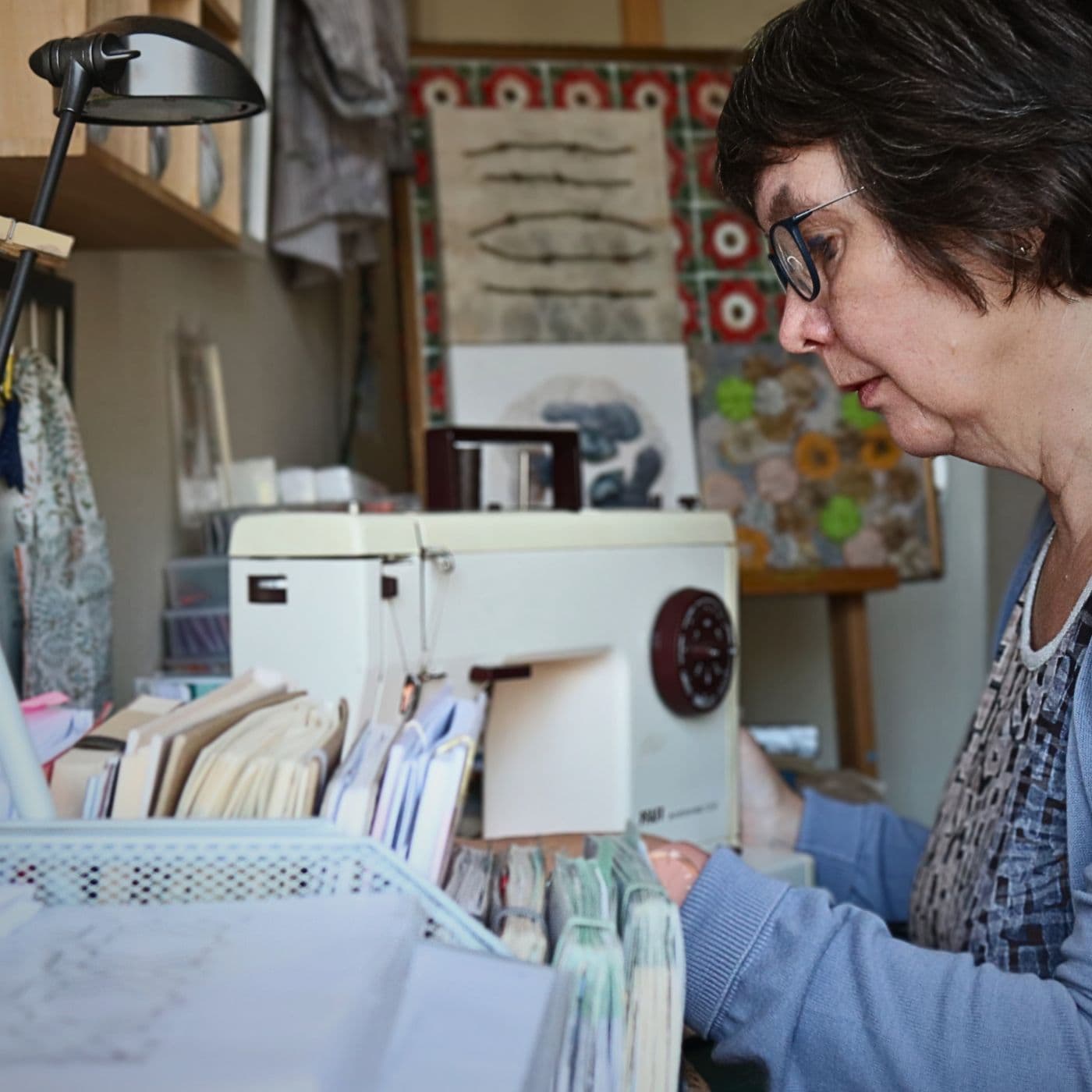 Linda Langelaan stitching on her machine in her home studio.