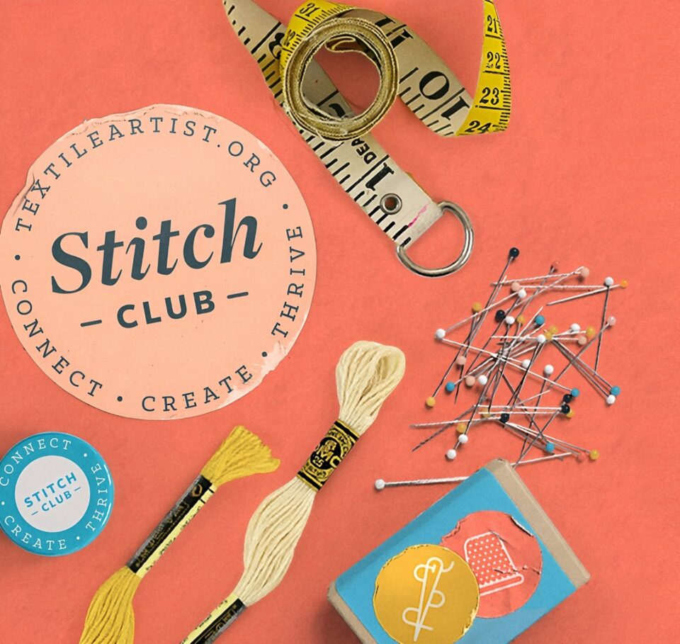 Flat lay of sewing tools including a measuring tape, embroidery floss, and pins on a bright background, promoting the Stitch Club textile art online membership