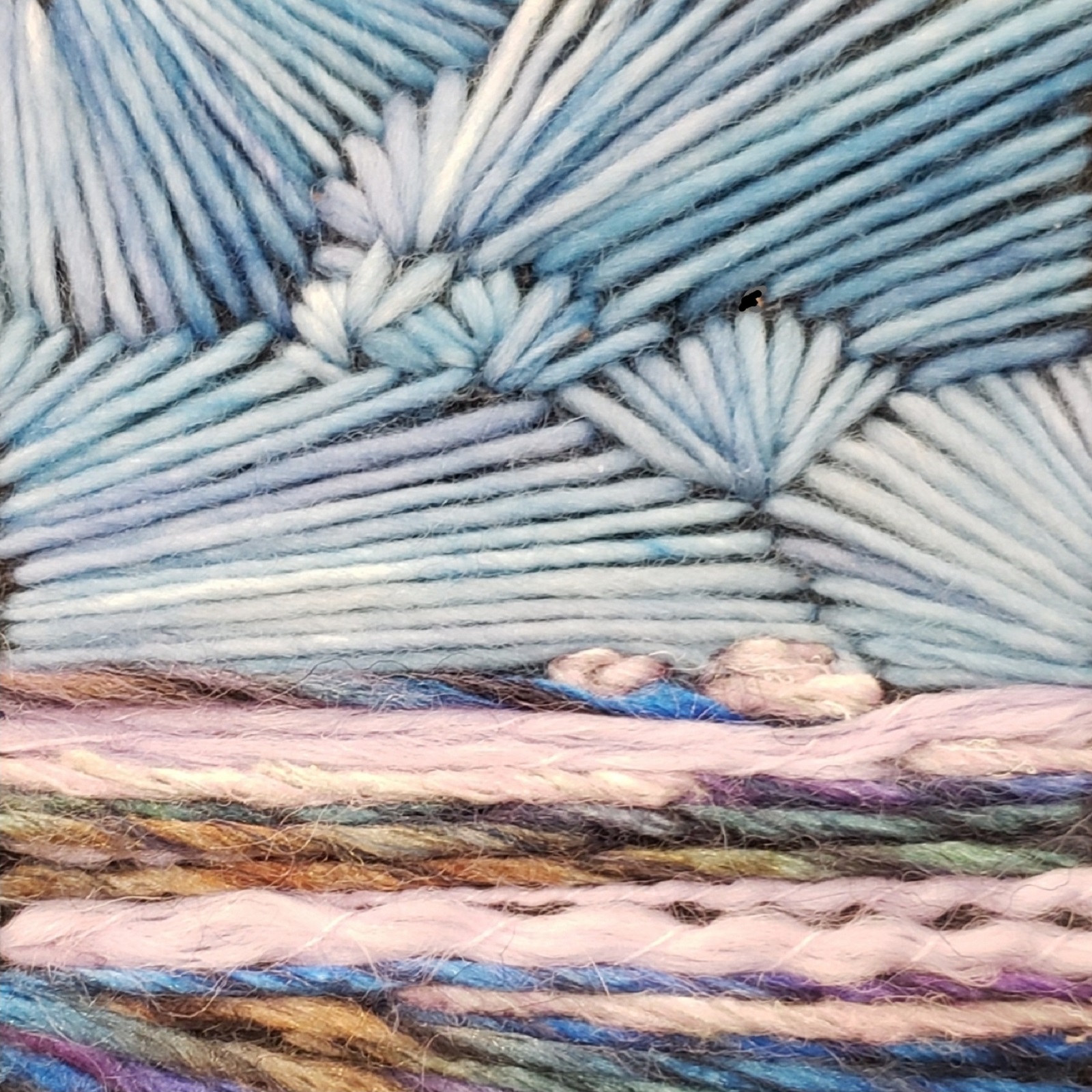 Monika Kinner, Prairie Skies (detail), 2019. 6cm x 12cm (2.5” x 5”). Freestyle hand stitching. Yarn and felt.