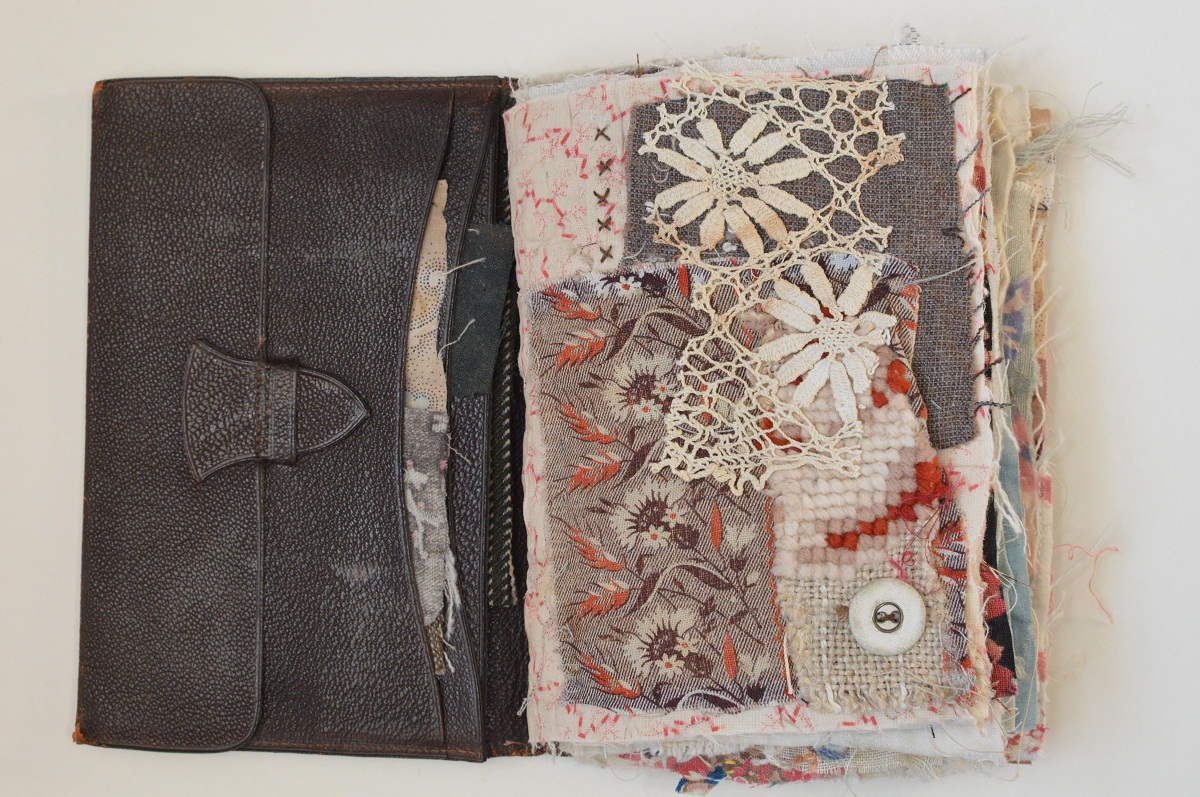 Mandy Pattullo, Wallet Book, 2019. 23cm x 16cm (9" x 6"). Appliqué, hand embroidery, pamphlet stitch. Leather wallet, vintage materials, stranded embroidery threads.