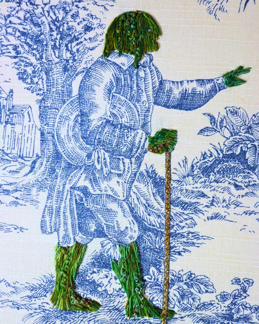 a close up of a person with a cane hand-stitched in green thread.