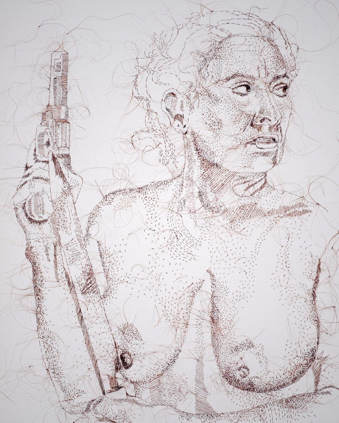 A stitched artwork of a naked woman holding a gun.