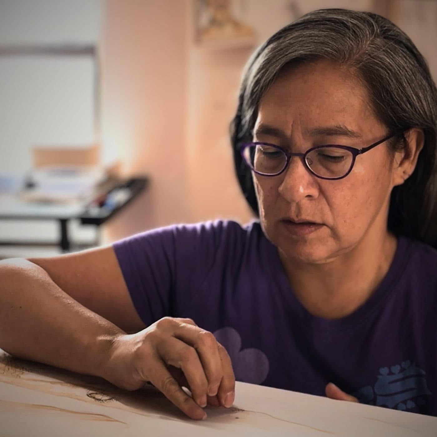 Rosemary Meza-DesPlas sewing in her studio in Farmington, New Mexico.