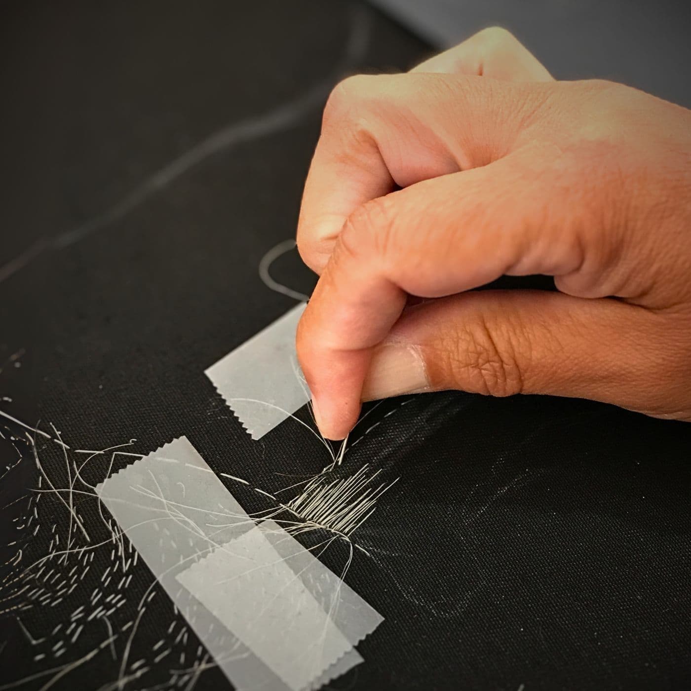 Rosemary Meza-DesPlas sewing in her studio in Farmington, New Mexico.