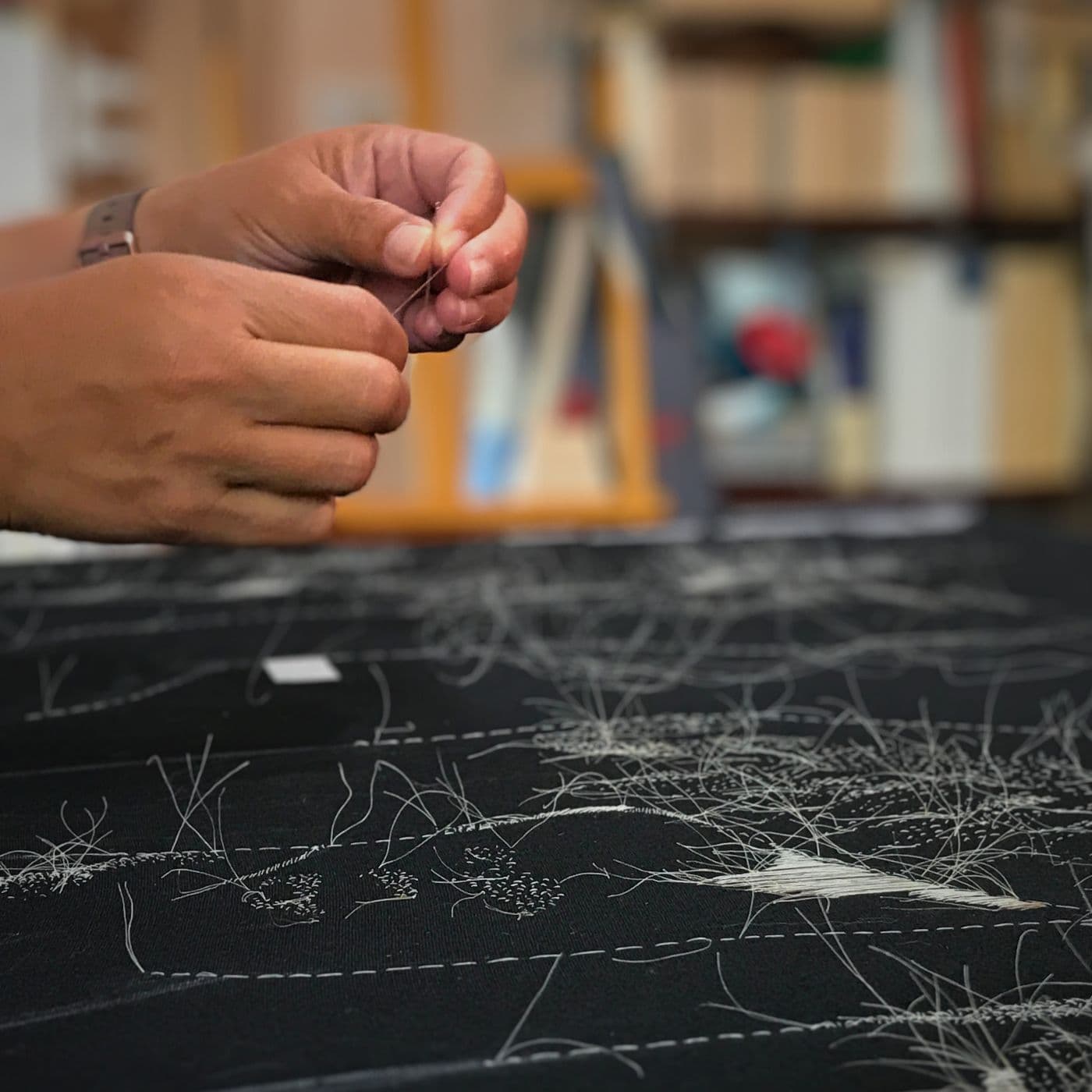 Rosemary Meza-DesPlas sewing in her studio in Farmington, New Mexico.