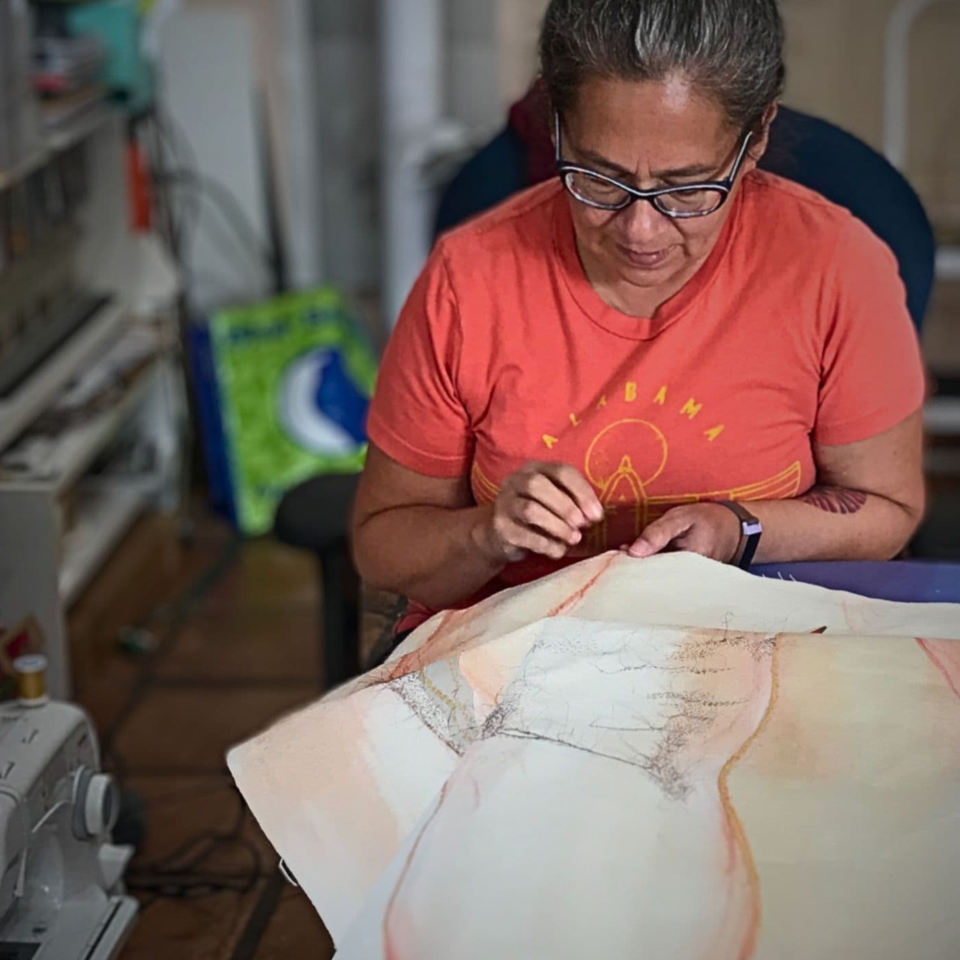 Rosemary Meza-DesPlas stitching a large artwork in her studio in Farmington, New Mexico.