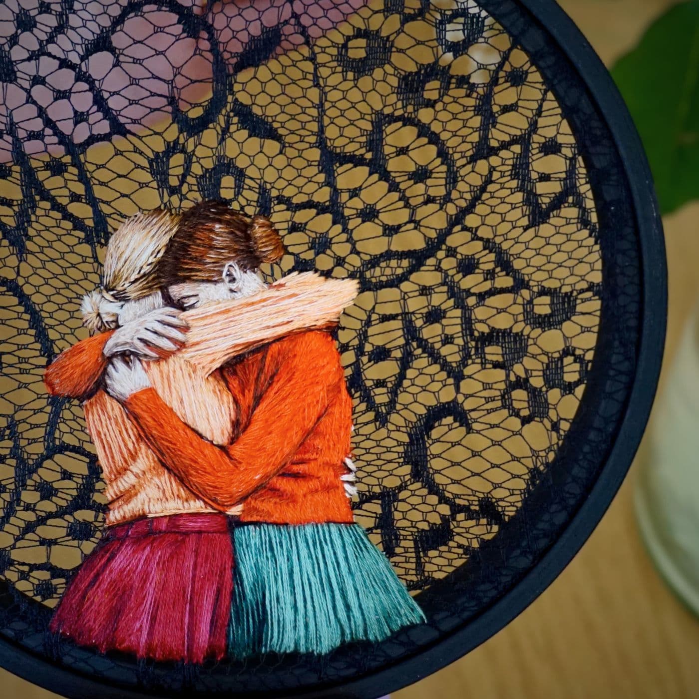 An embroidery of two women hugging