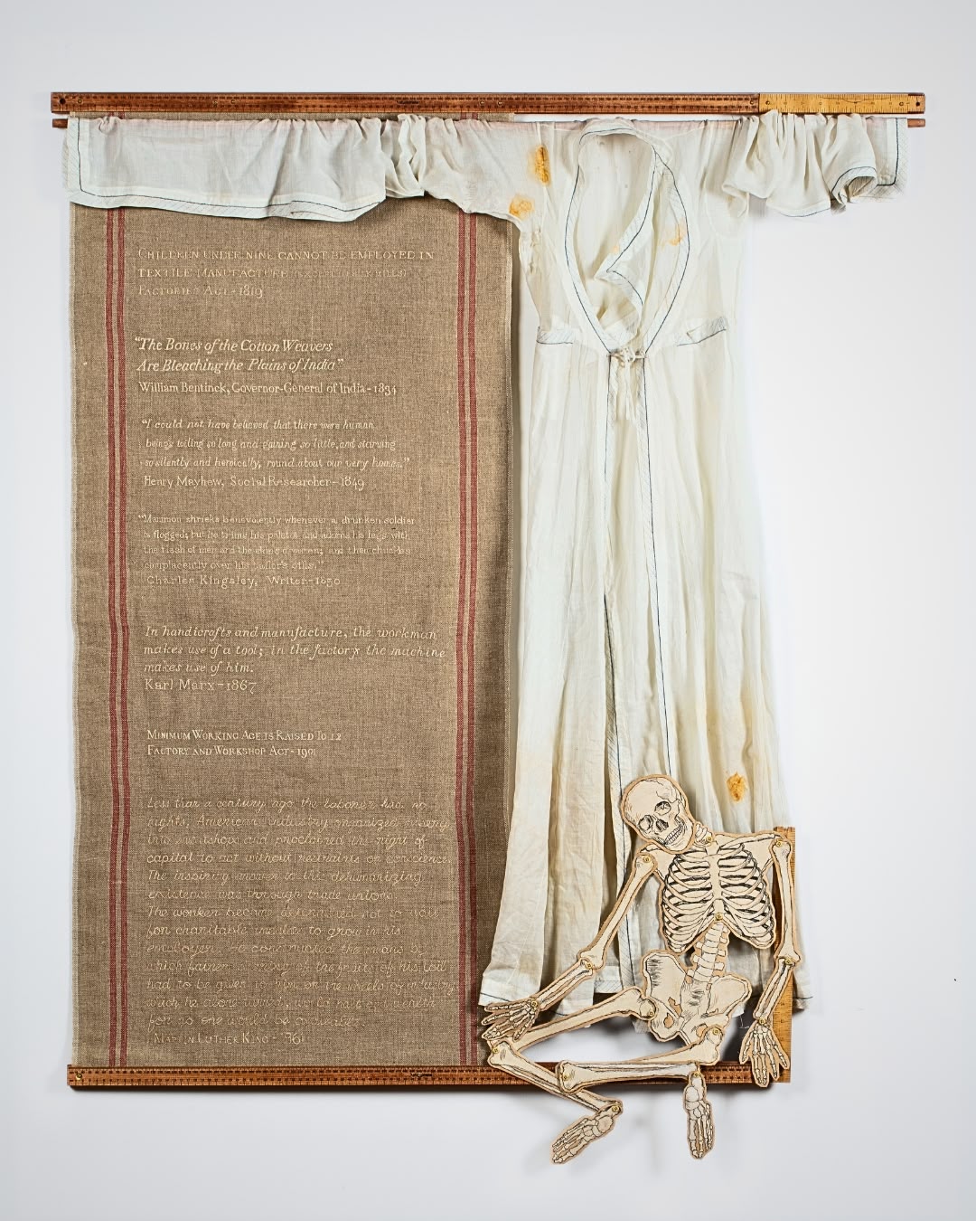 a skeleton and a piece of cloth on a wall