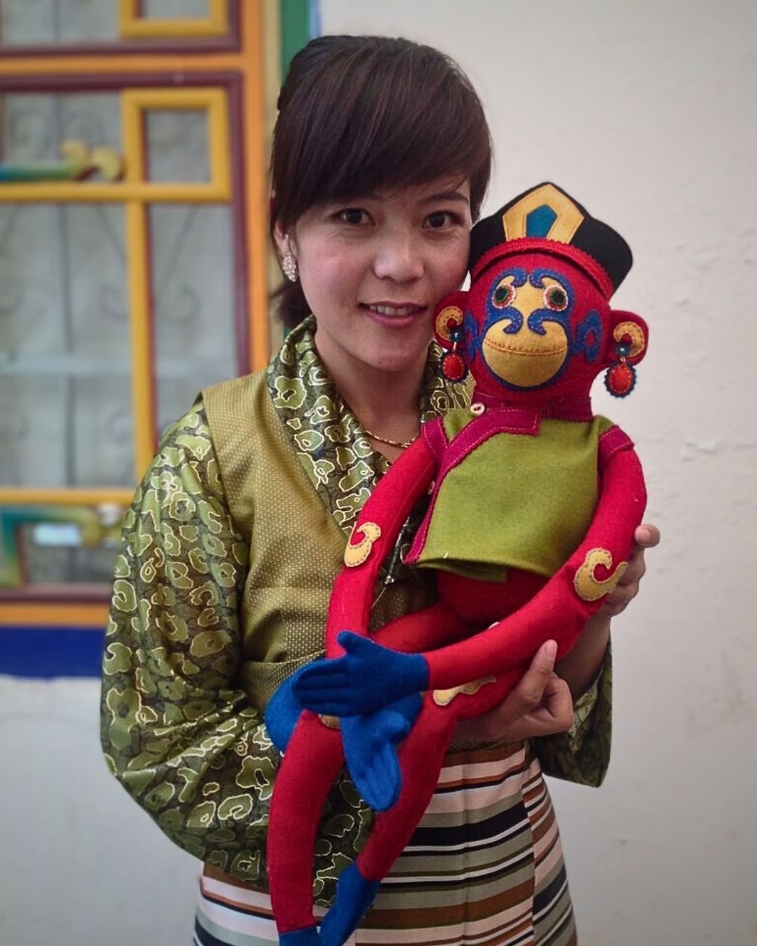 a woman holding a stuffed animal