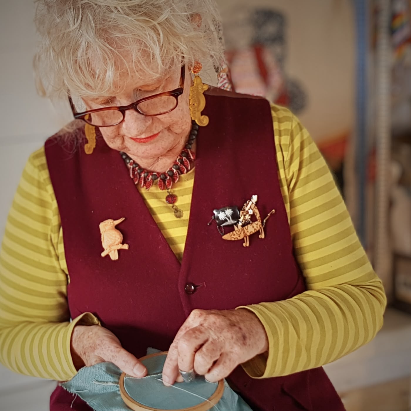 a woman sewing with a fabric