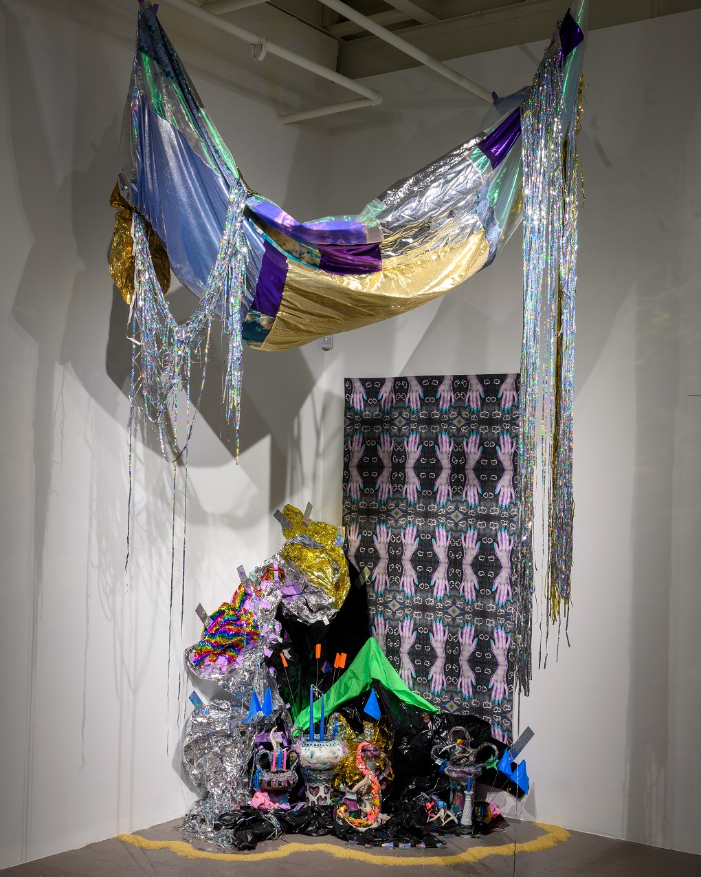 Zipporah Camille Thompson, Carolina Gold, 2022. Dimensions variable. Stoneware, oxides, glazes, vinyl, custom digitally printed fabrics, mylar, lame, cotton, tape, antlers, Carolina Gold rice, blue chandelier glass. Hand building, digital photo manipulation, sewing, braiding, crochet, crumpling.