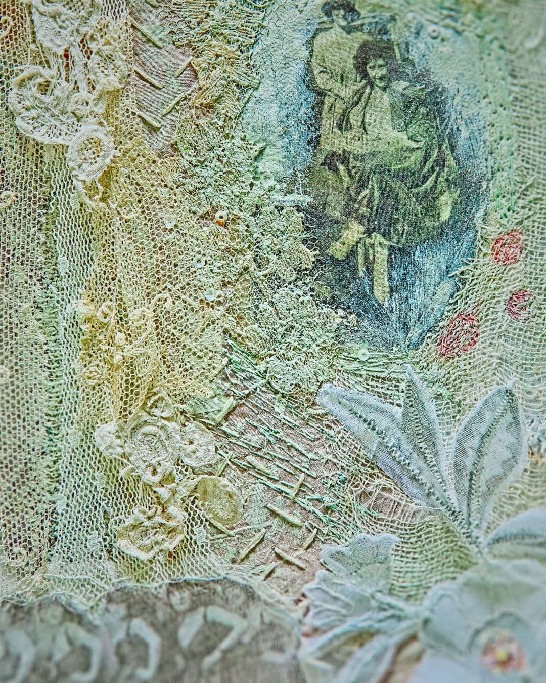 A close up of an intricately stitched artwork