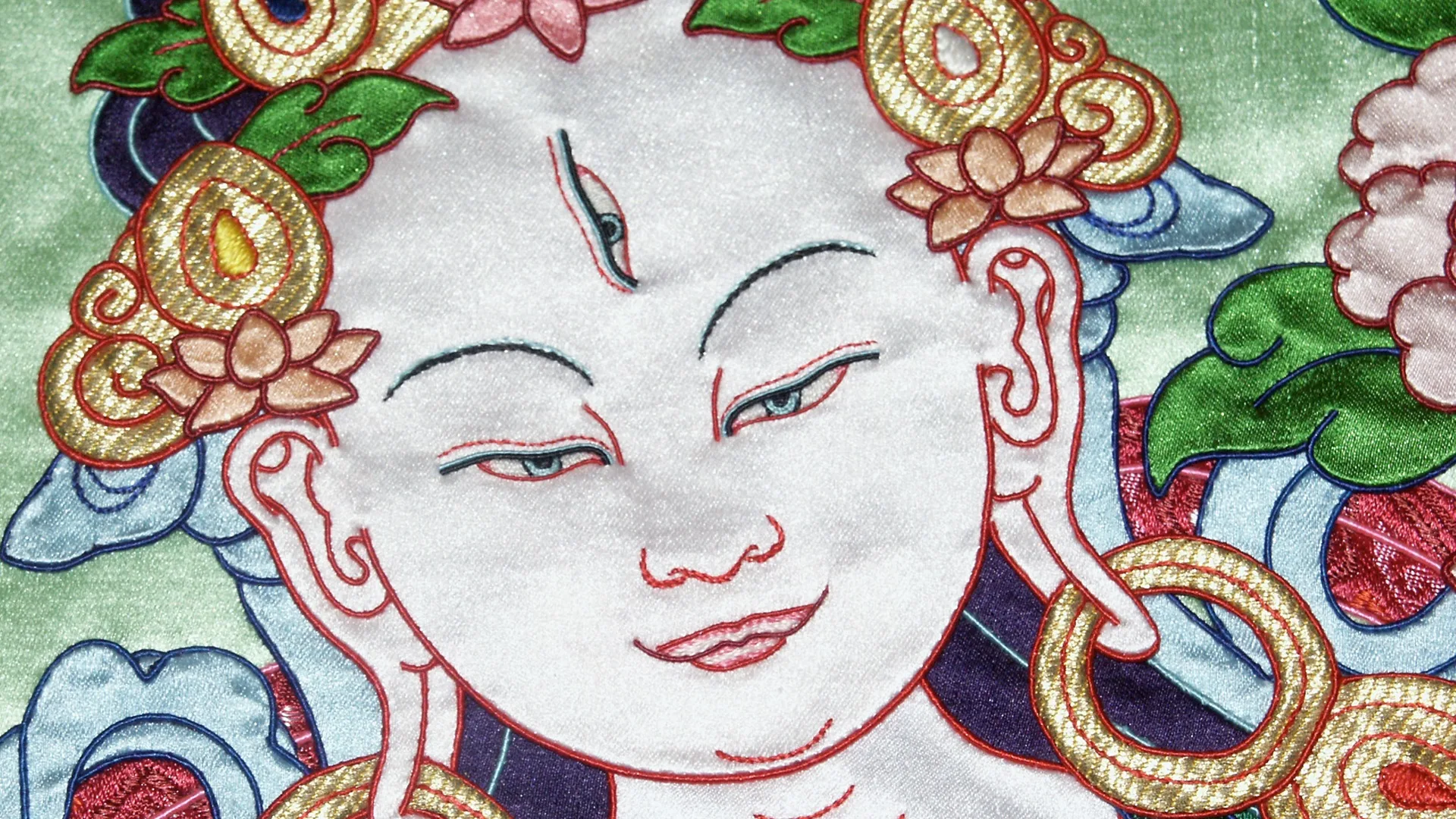 Leslie Rinchen-Wongmo, White Tara (detail), 2001. 74cm x 51cm (29" x 20") plus brocade frame 147cm x 76cm (58" x 30"). Hand stitch, Tibetan appliqué. Silk satin, brocade, horsehair.