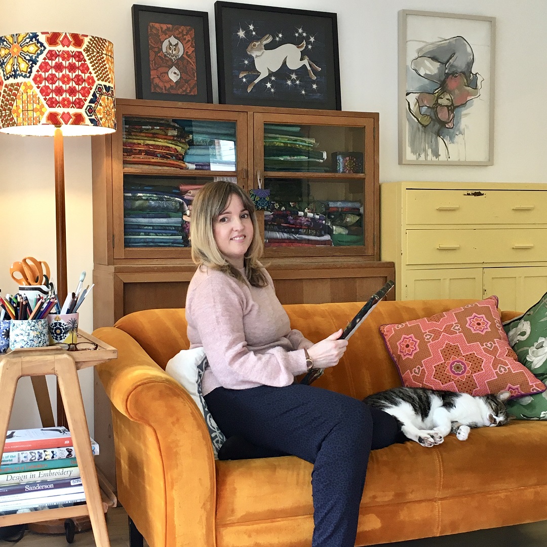 Yvette Phillips working at home with Basil the cat.