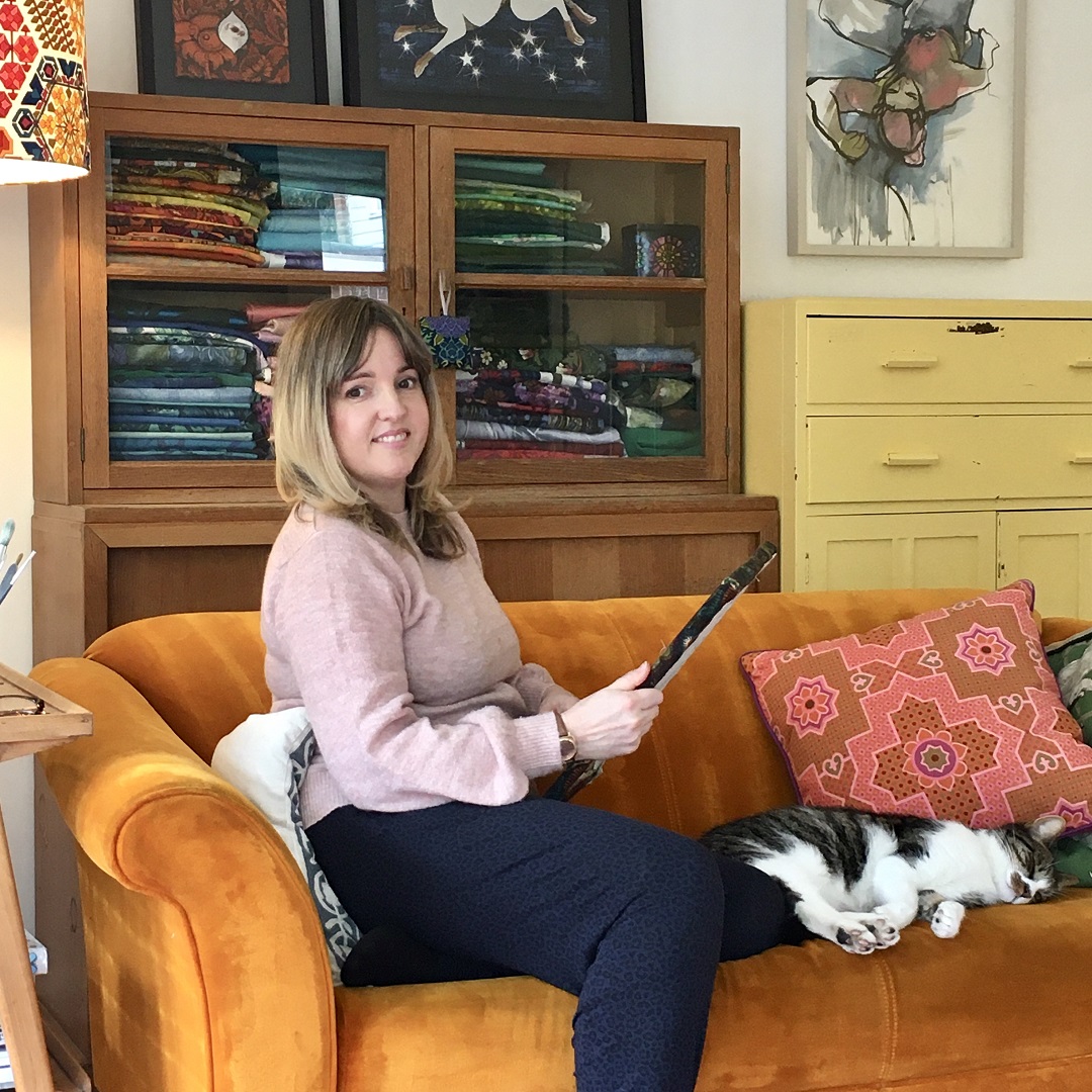 Yvette Phillips working at home with Basil the cat.